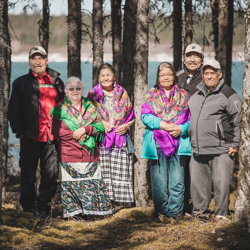Family in the forest smiling