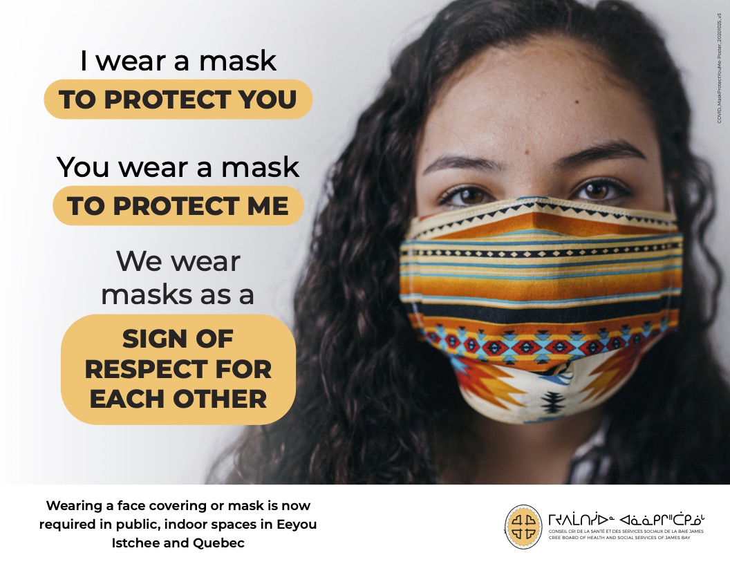Woman wearing mask with poster slogan in background