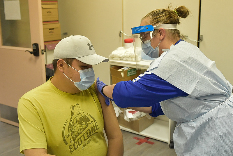 Young man receives vaccination