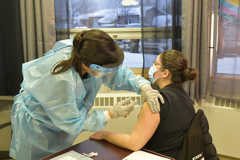 Young woman receives vaccination