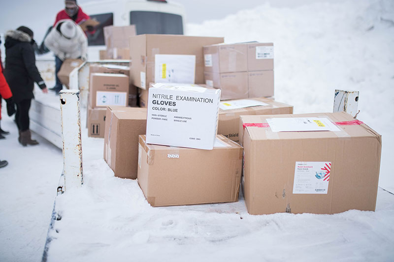 Box of Nitrile Examination Gloves siting on top of other boxes