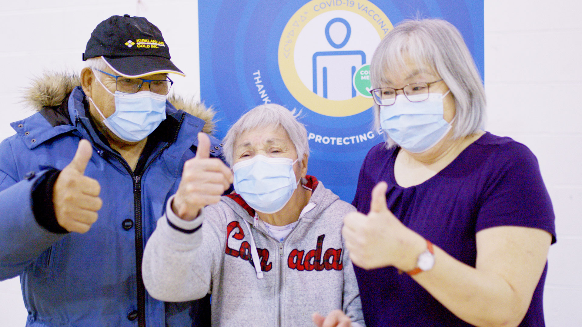 Dr. Kitty and her parents give thumbs-up