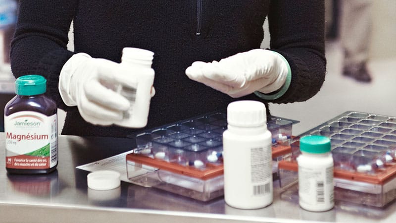 Closeup of pills being counted out