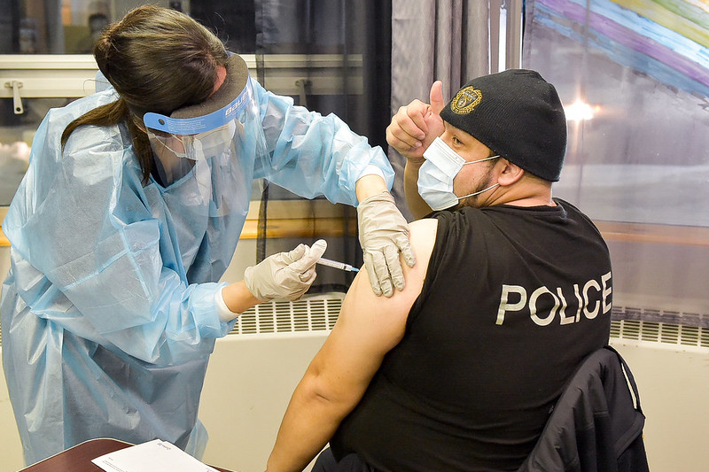 Police officer receives vaccination