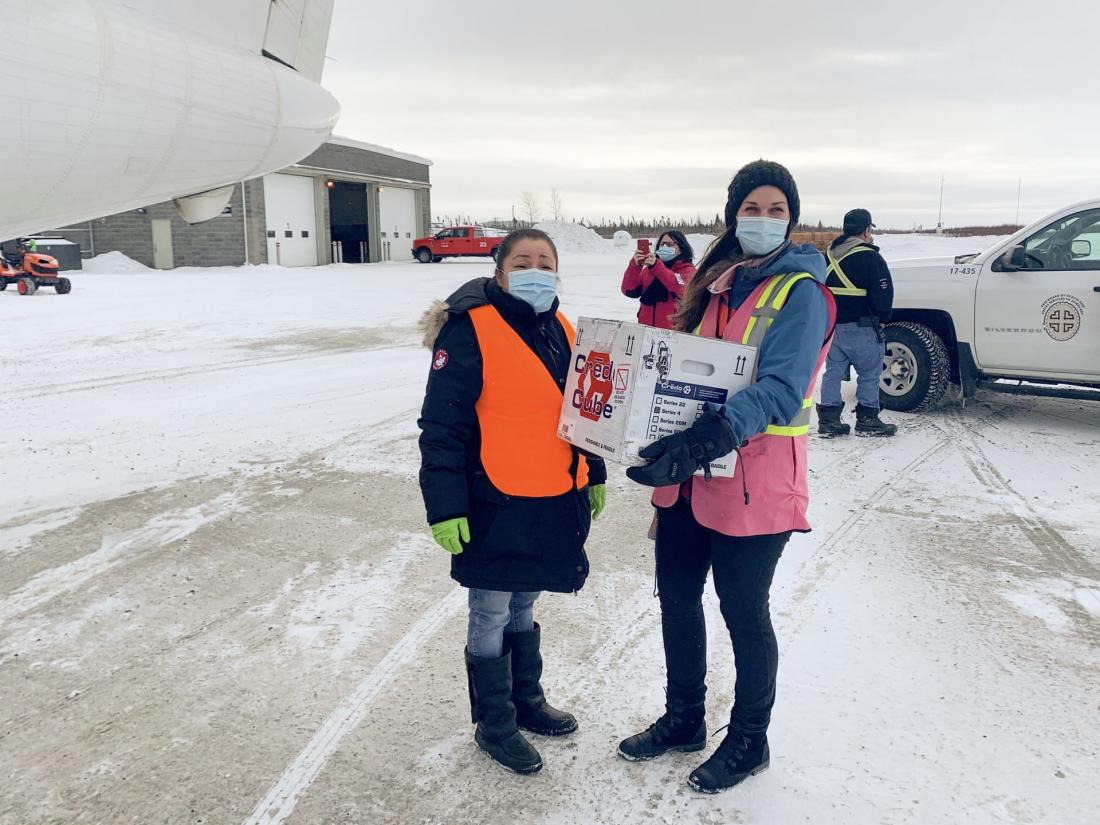 Priscilla Weapenicappo, Coordinator Current Services and Chishaayiiyuu and Vallerie Potvin, Lead Vaccination Nurse who is carrying the box of vaccines for Eastmain