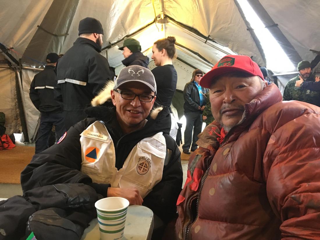 Jason Coonishish and a man inside a tent during Operation Nanook-Nunalivut 2019 in the Arctic 