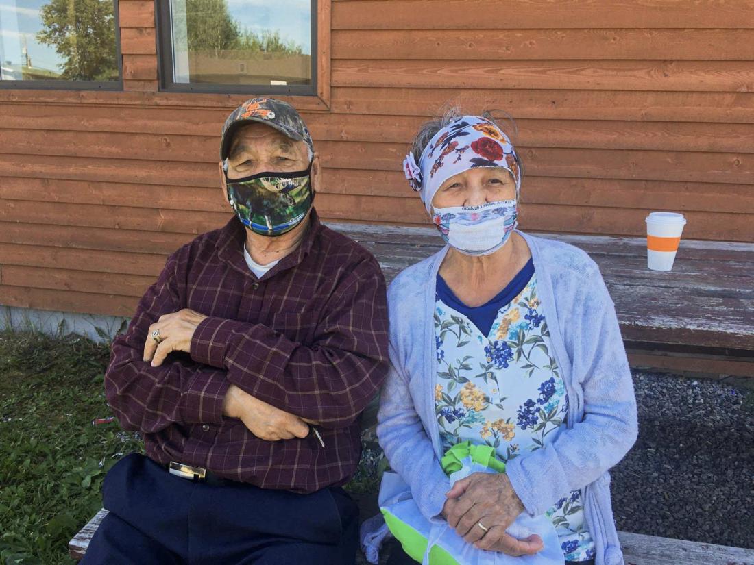 2 elders wearing masks