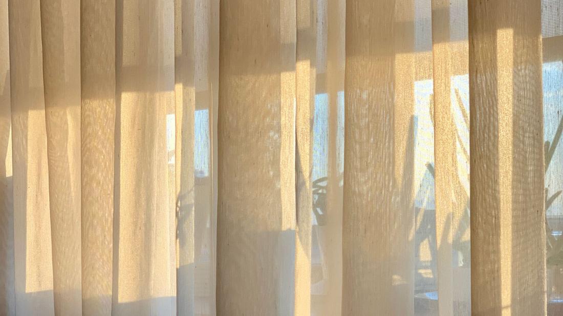 View of curtains from inside of home