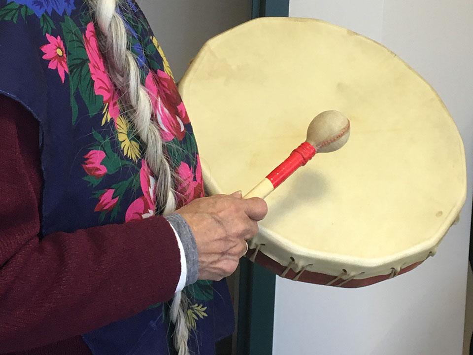 Elder playing drum