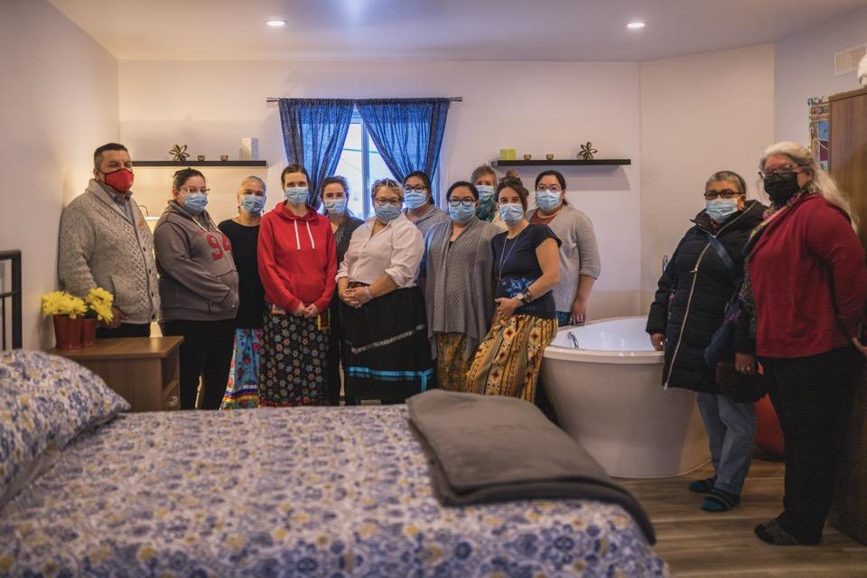 Group of people standing in birthing room