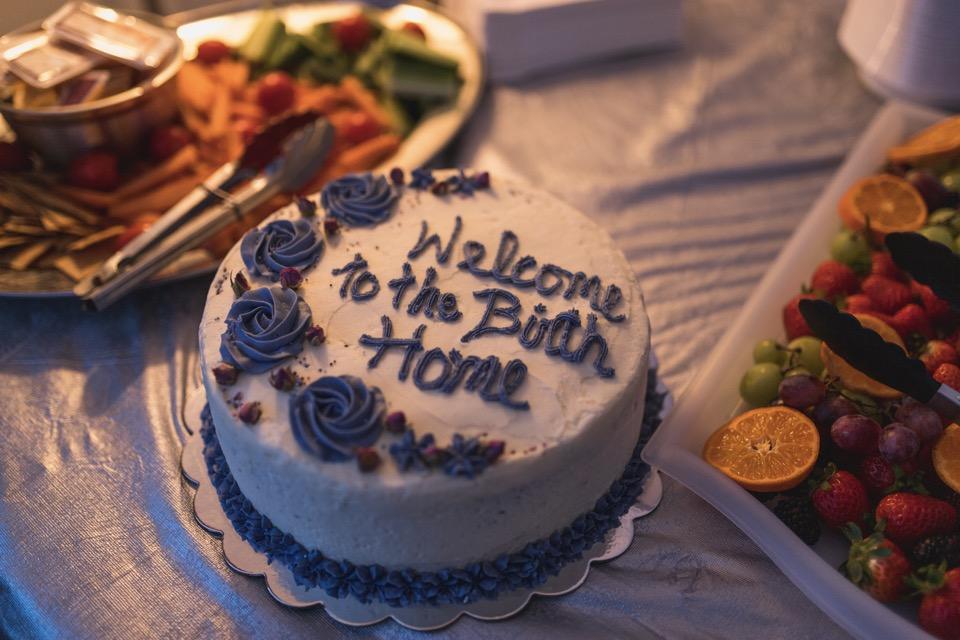 Cake with words in icing, "Welcome to the Birth Home"