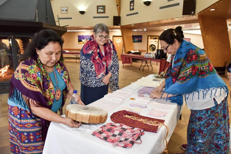 Elders prepare food for baby ceremony