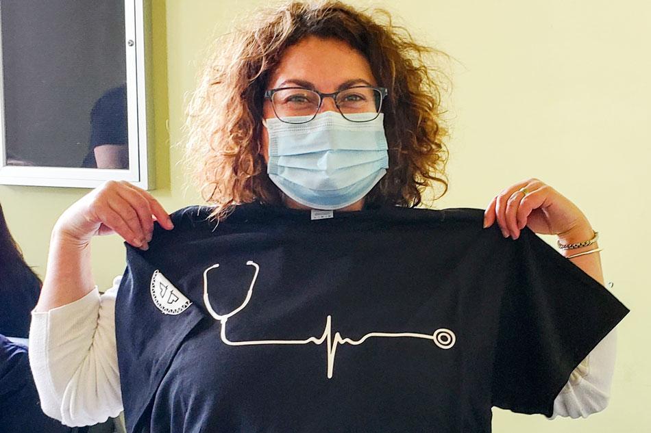 Nurse shows off tshirt given as a gift