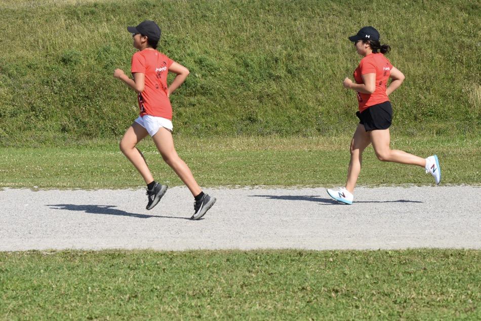 Daughter passes mother while running on sports track