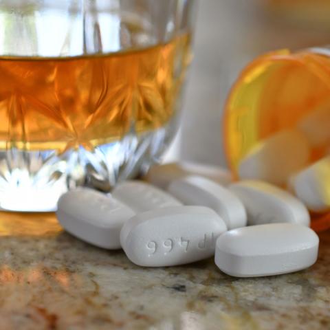 Pills and glass of alcohol