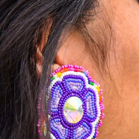 Ear with colourful earrings